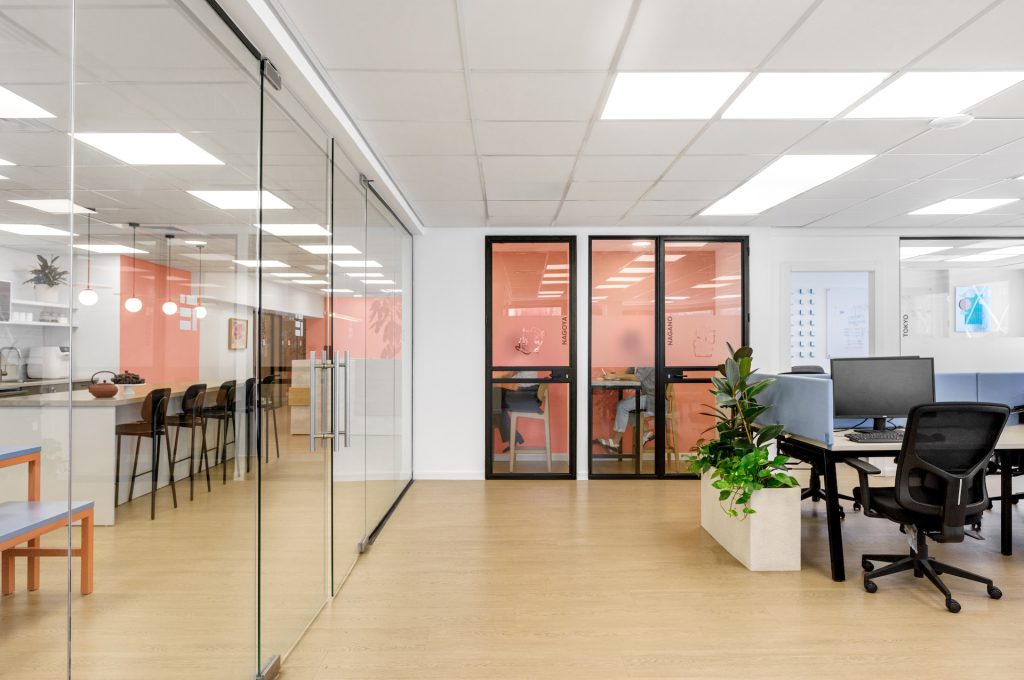 Glass corridor leading to the orange phone rooms
