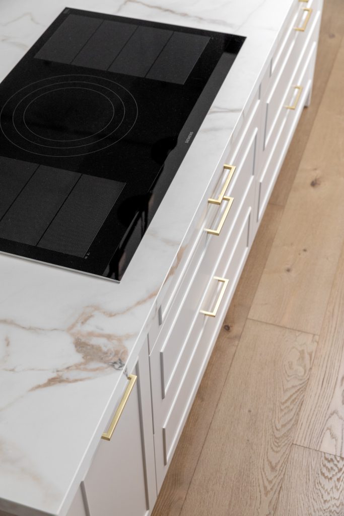 Detail: marble worktop and black induction hob