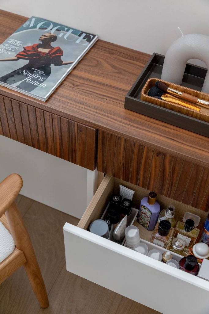 Detail: open drawer in a walnut dressing table