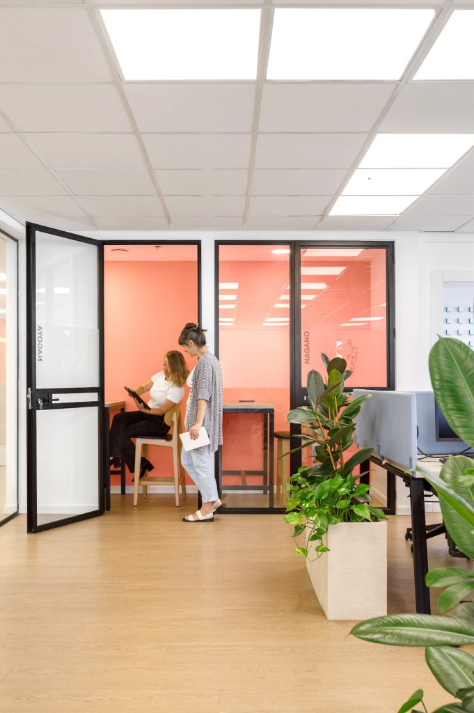 Small meeting room with black glass doors
