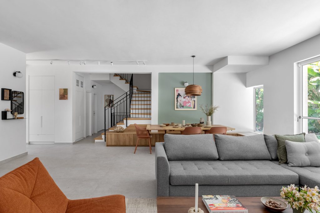 Grey corner sofa, looking to the dining area and stairs