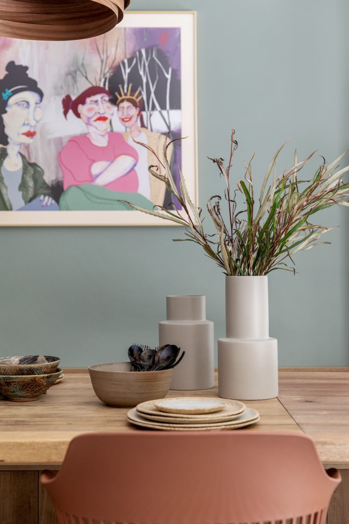 Detail: ceramics and dried branches on the dining table