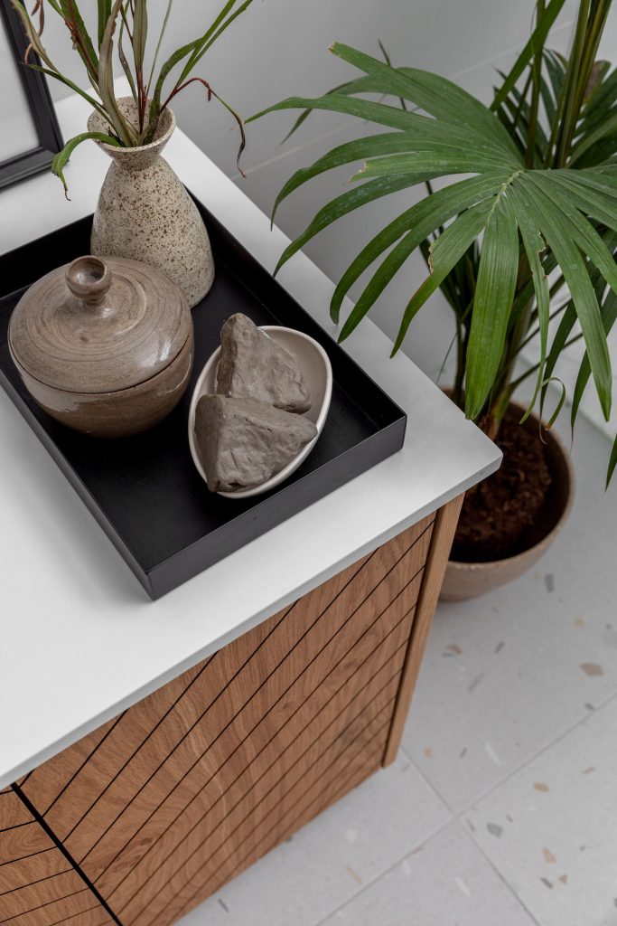 Detail: black tray with ceramics on a vanity