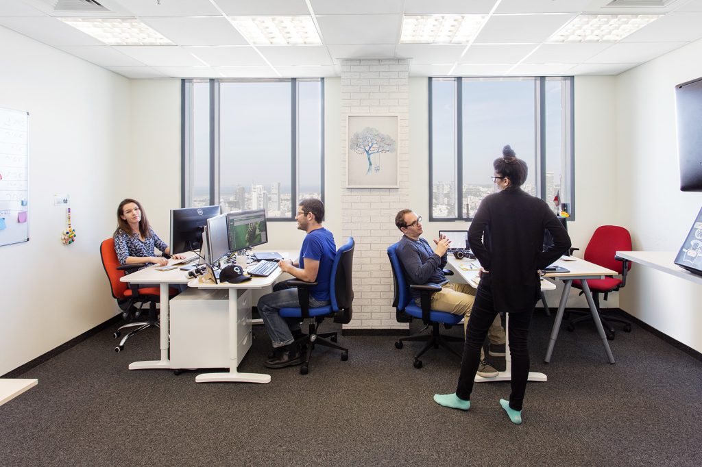 Bright work room with white desks