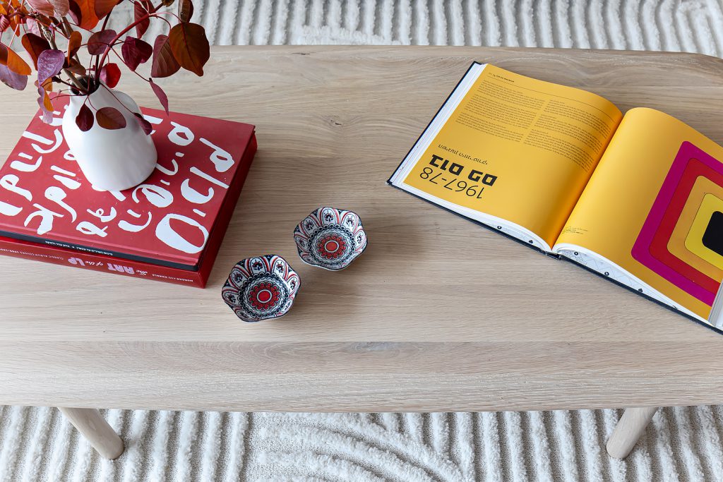 Detail: light wood coffee table with colourful books