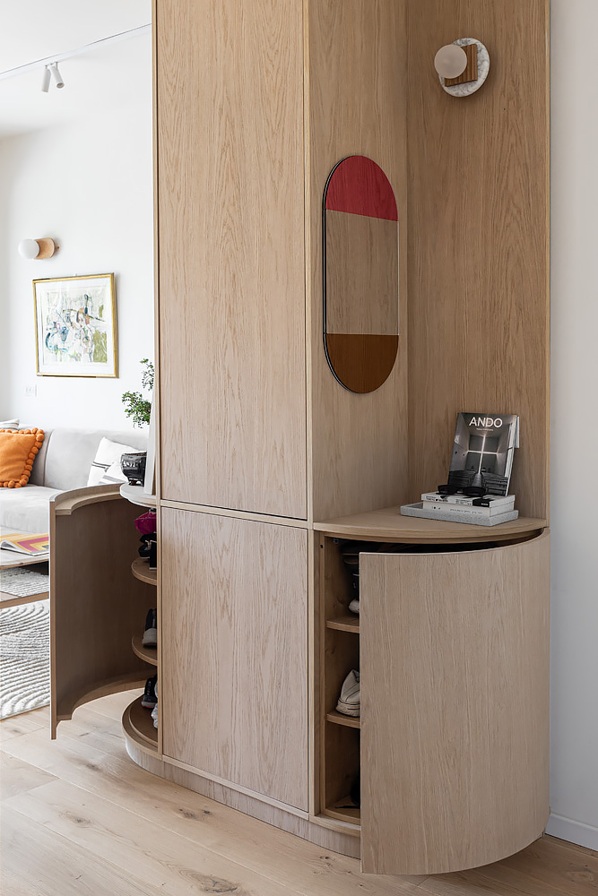 Entrance cabinet with its curved door open