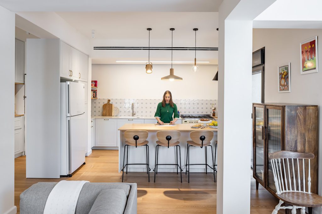 View from the living room to the kitchen and a vintage wooden cabinet
