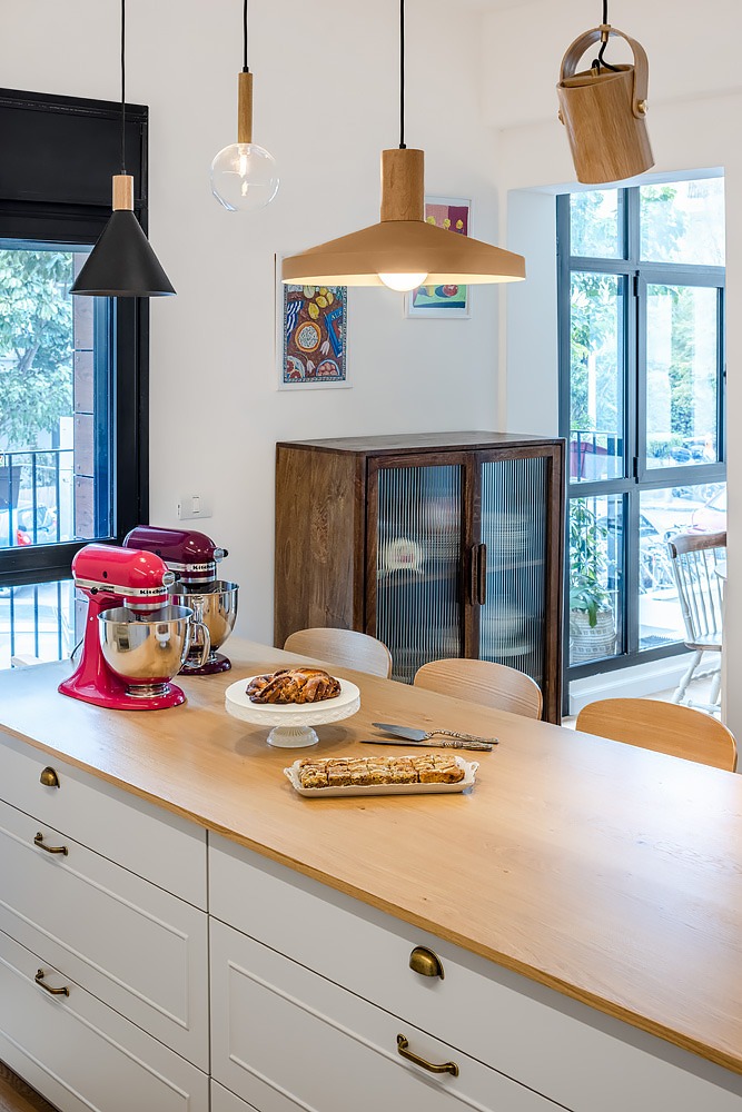 Wooden island counter and wooden pendant lamps