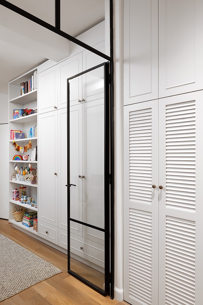 Hallway with louvred cupboards and open pantry shelves