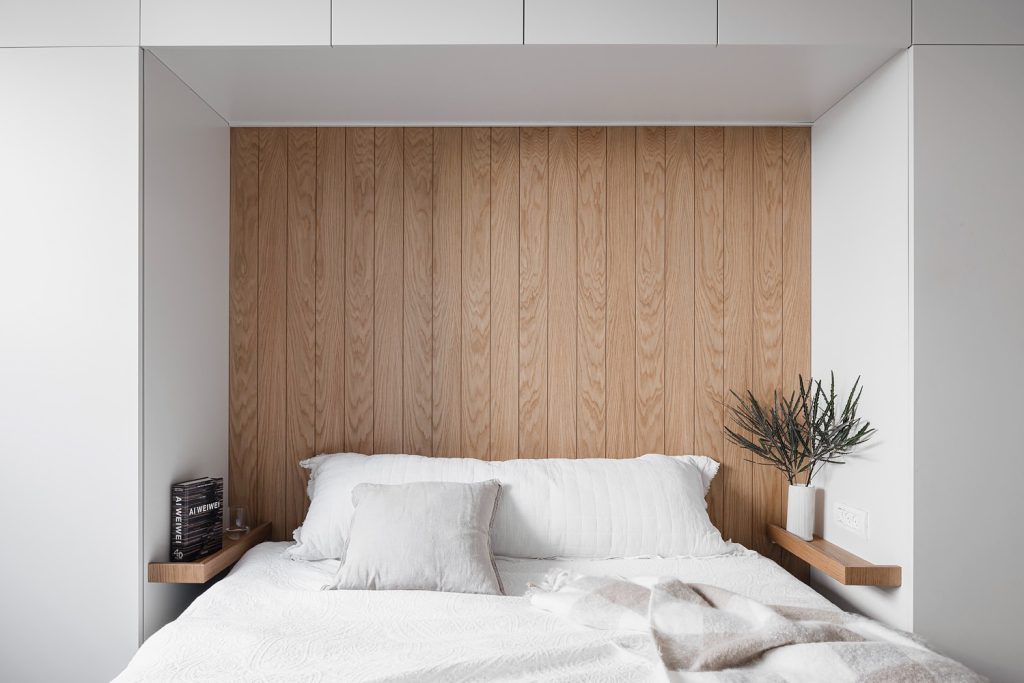 Bedroom with a wood-lined bed alcove