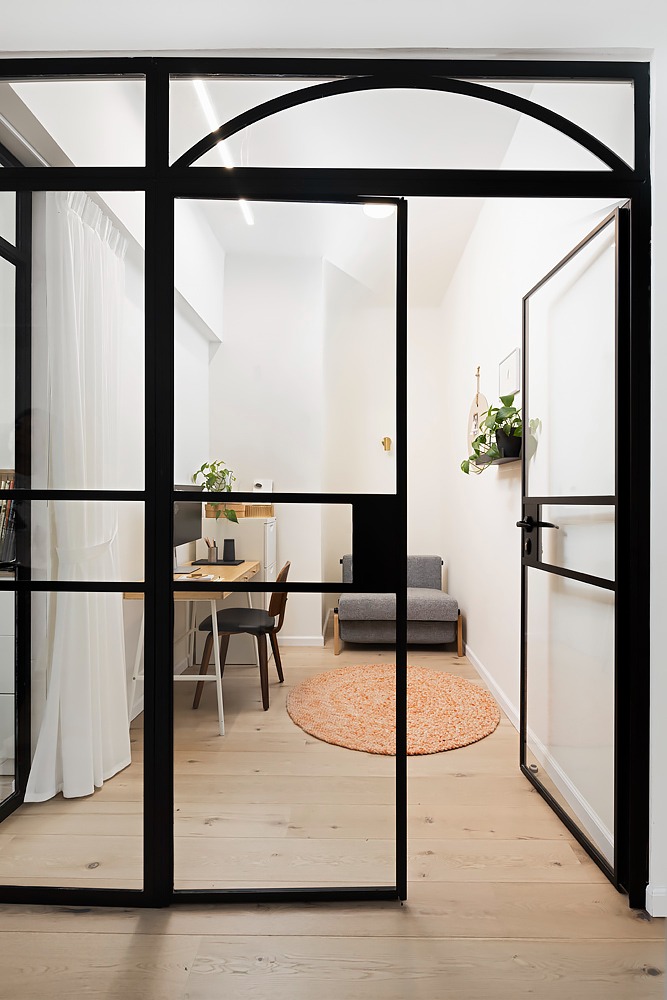 Black arched French doors to a study