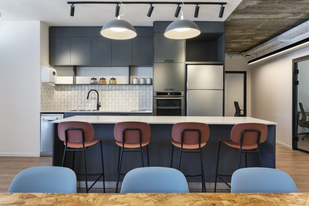 Navy office kitchen with terracotta bar stools, Lofi offices in Tel Aviv – Chen Shadmi, Shadmi Design