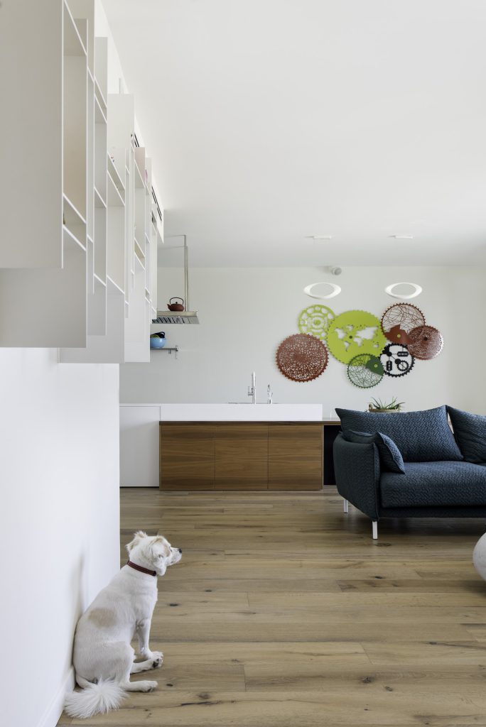 View from the kitchen to the living room with woven wall plates