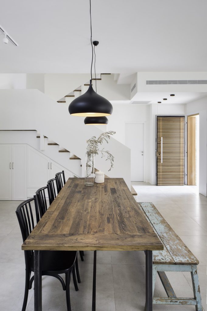 Long dining table looking to the front door