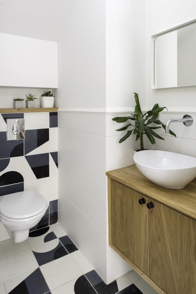 Guest toilet with graphic black-and-white tiles