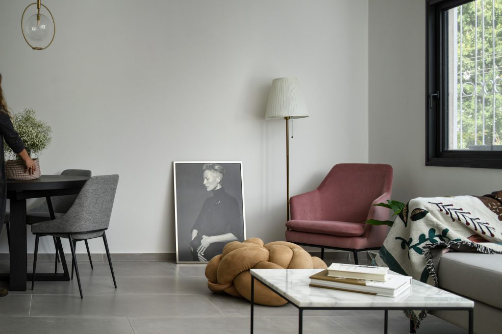 Pink armchair, a knot pouf and a white coffee table