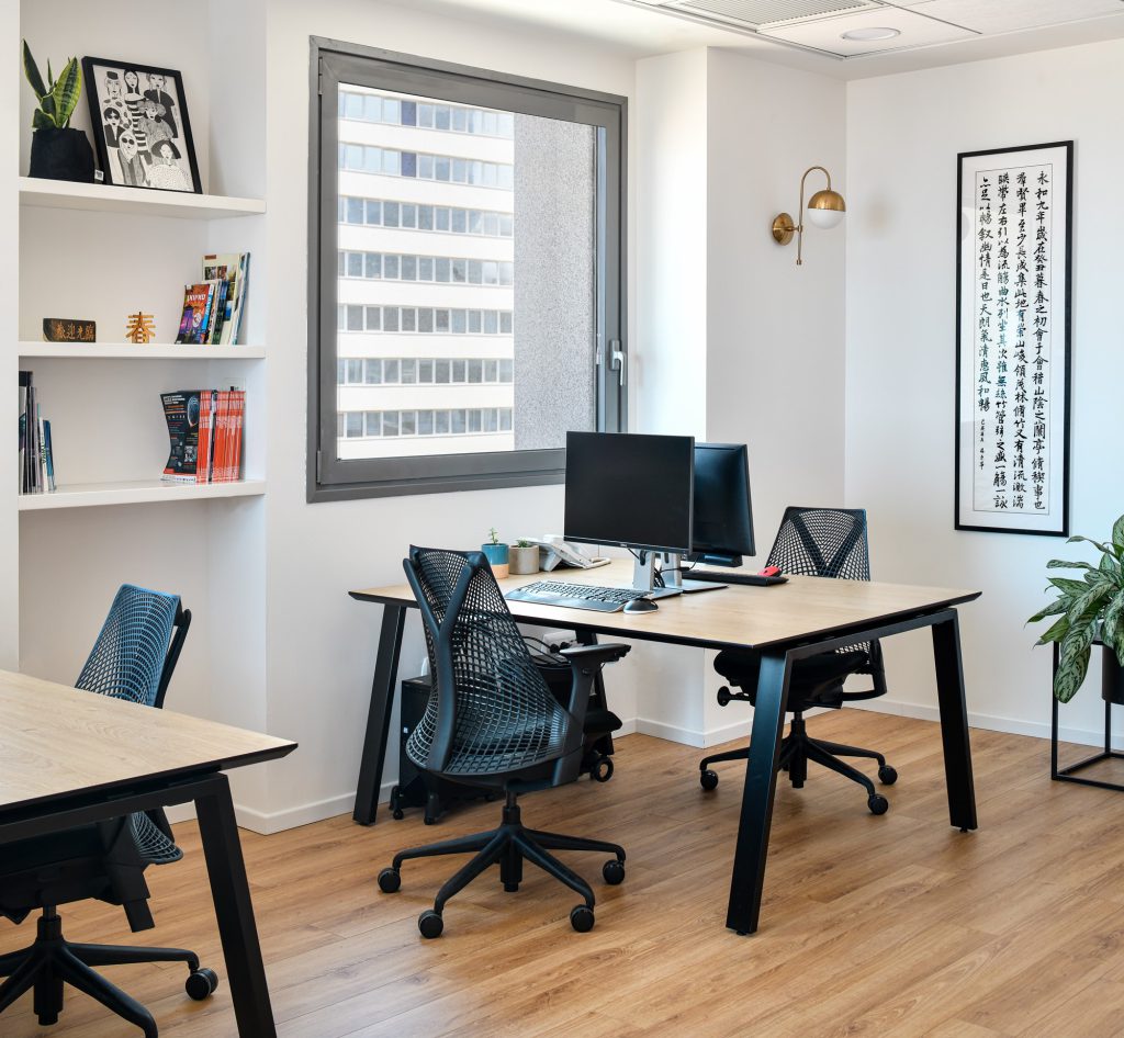 Manager's office with bookshelves and wall calligraphy