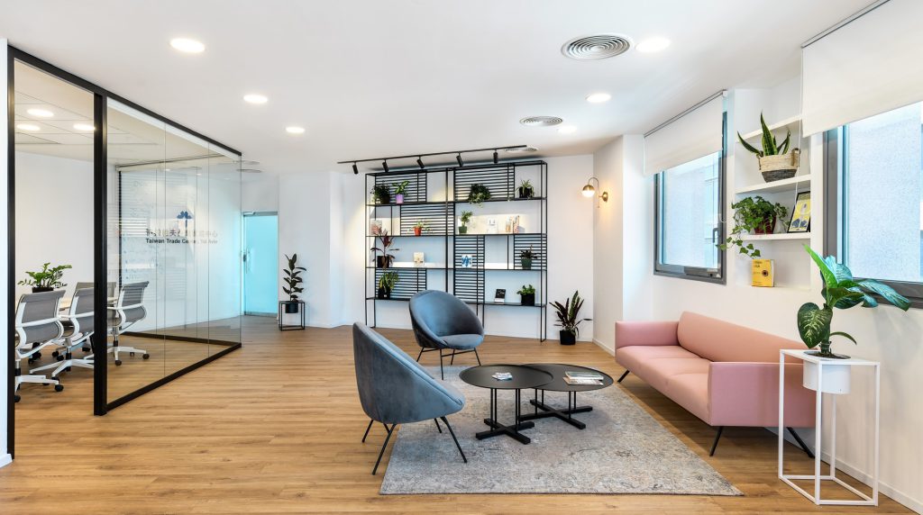 Lobby with a pink sofa and blue armchairs
