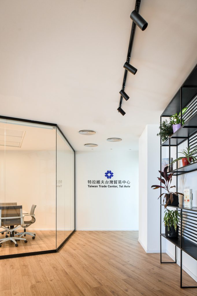 View into the glass boardroom from the corridor