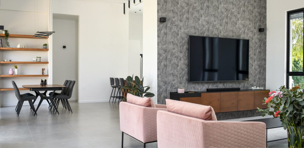 Stone wall with a floating wooden TV unit