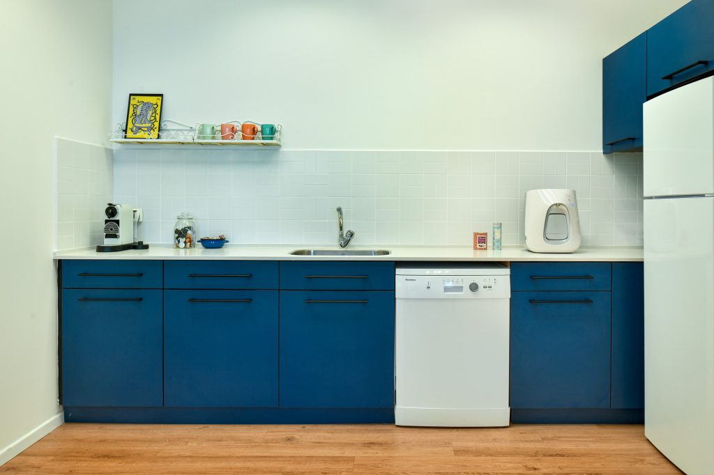 Blue-and-white kitchenette along the wall