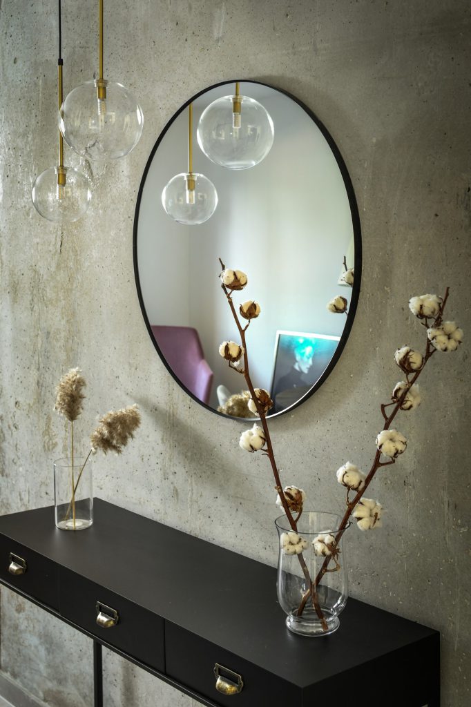Detail: black console with cotton branches