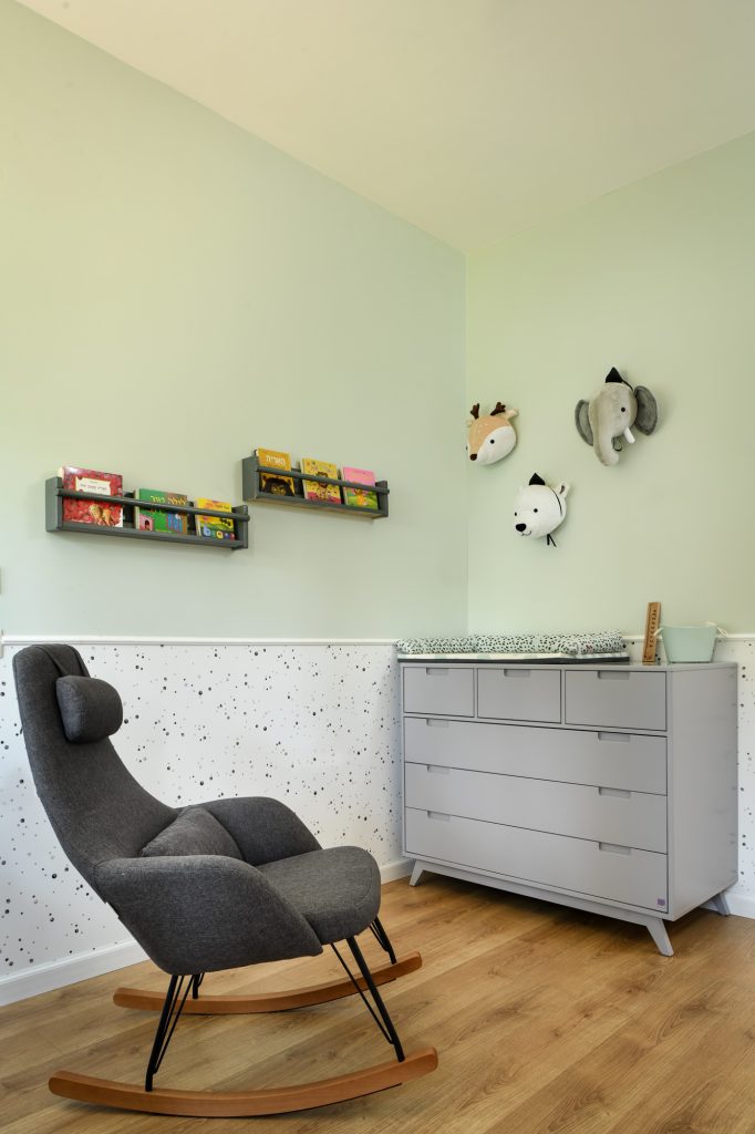 Rocking chair and changing dresser in the nursery